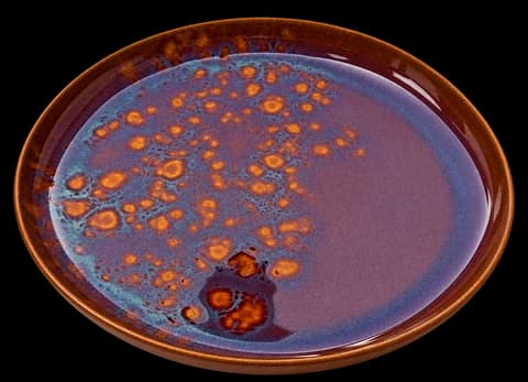 Amber-speckled glazed plate